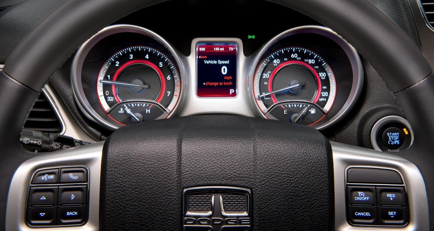 Display The driver information digital cluster display in the 2020 Dodge Journey showing the vehicle at idle.