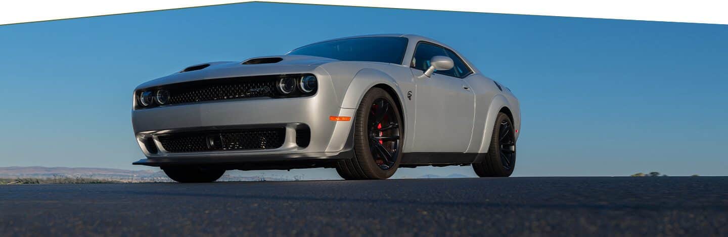 The 2020 Dodge Challenger SRT Hellcat Redeye on a racetrack with smoke billowing from the rear tires.