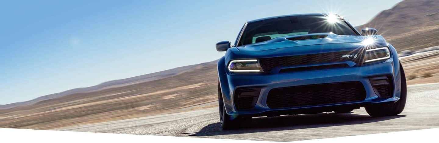 The 2020 Dodge Charger SRT Hellcat being driven on a desert road.