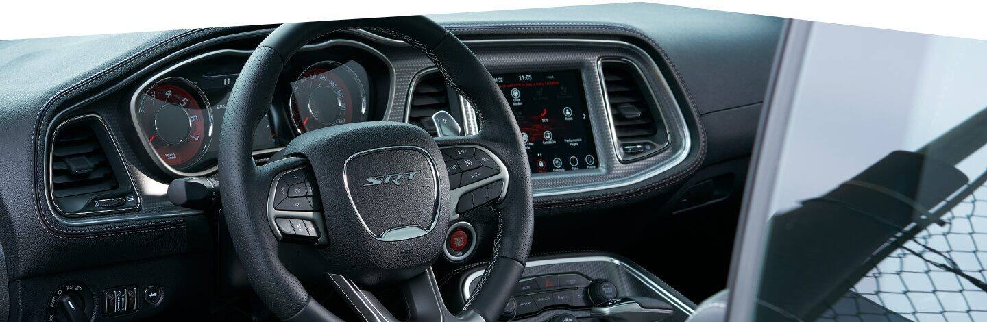 The instrument panel, steering wheel and touchscreen on the 2020 Dodge Challenger SRT.