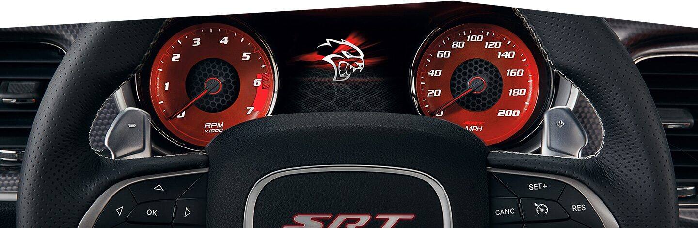The Driver Information Digital Cluster Display and steering wheel on the 2020 Dodge Charger.