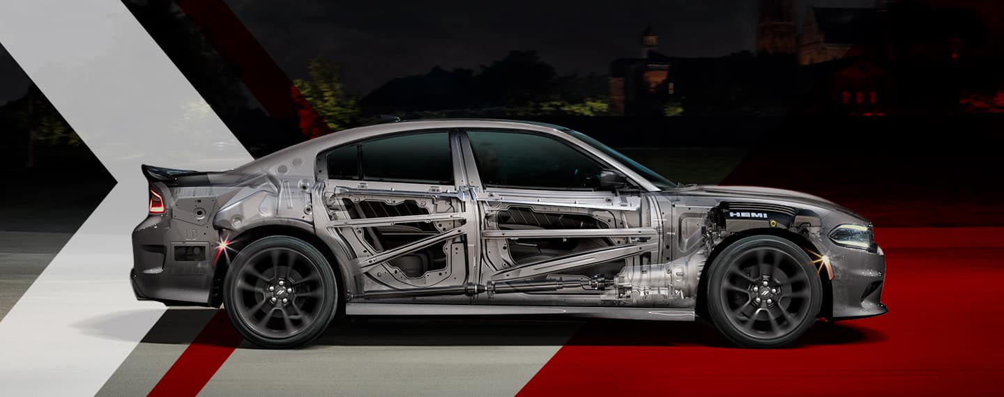 An under-the-skin passenger-side profile of a 2023 Dodge Charger highlighting the steel safety frame and door beams.