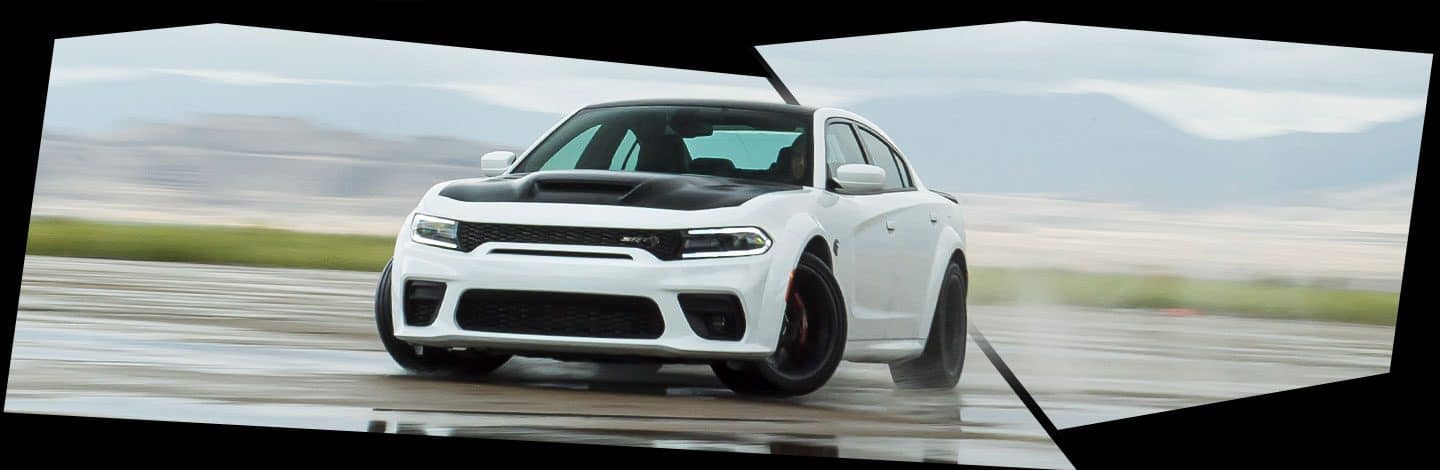 The 2021 Dodge Charger SRT Hellcat Redeye being driven on a track.