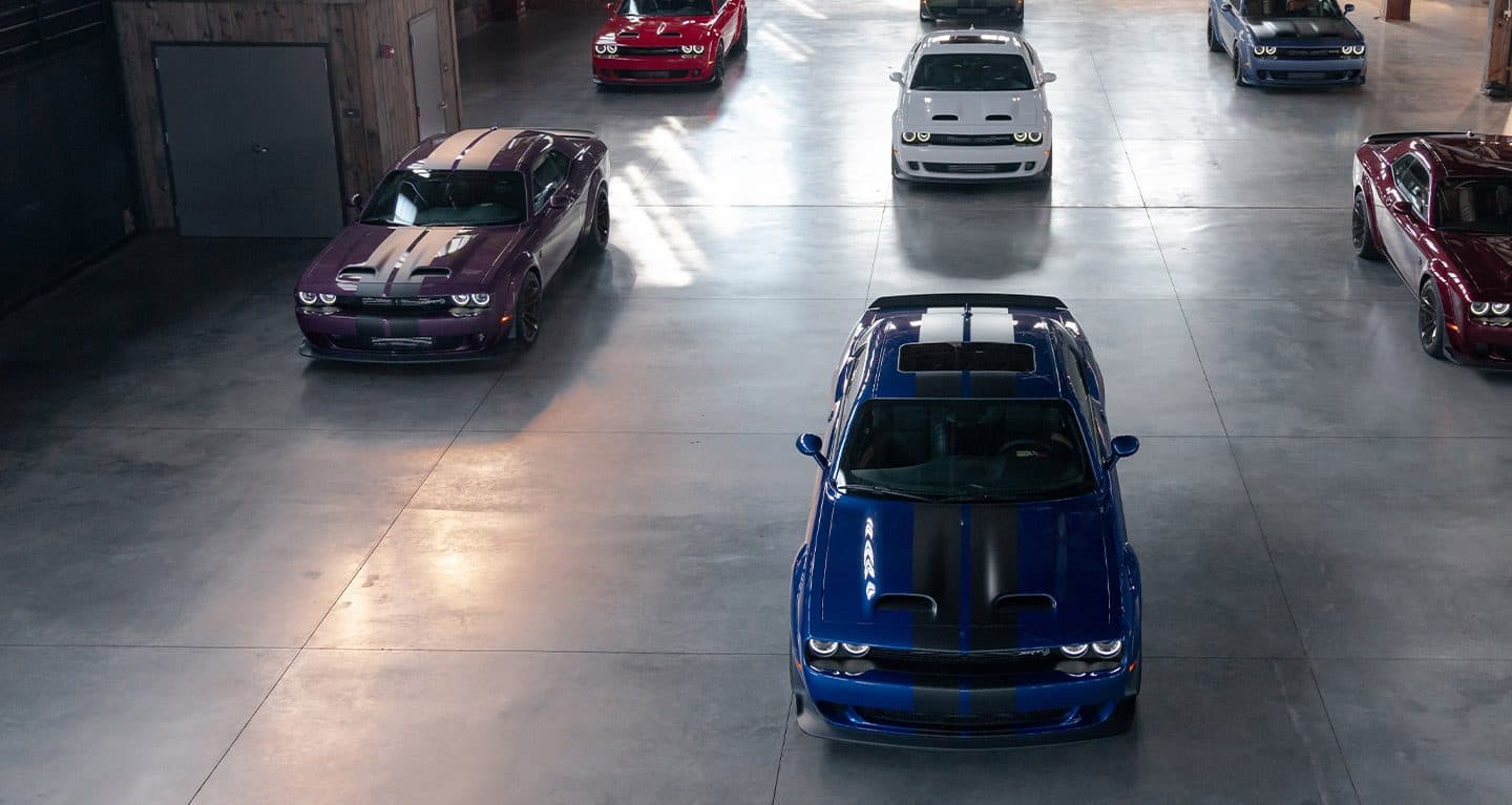 Display Shot from above showing seven 2022 Dodge Challenger SRT models in various colors.