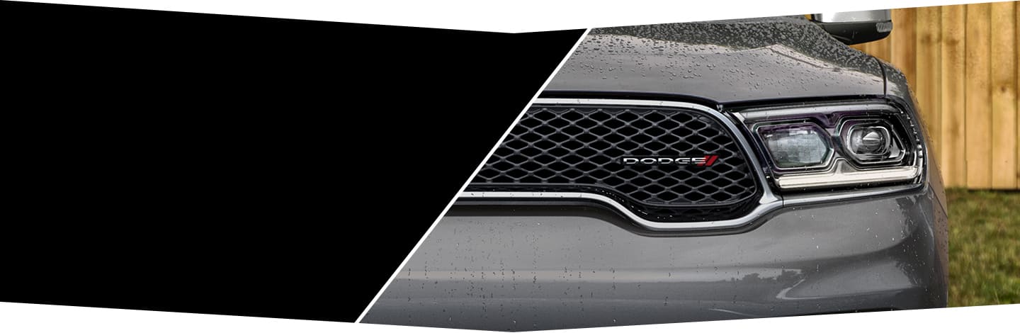 A close-up of the headlamp and grille on the 2022 Dodge Durango.