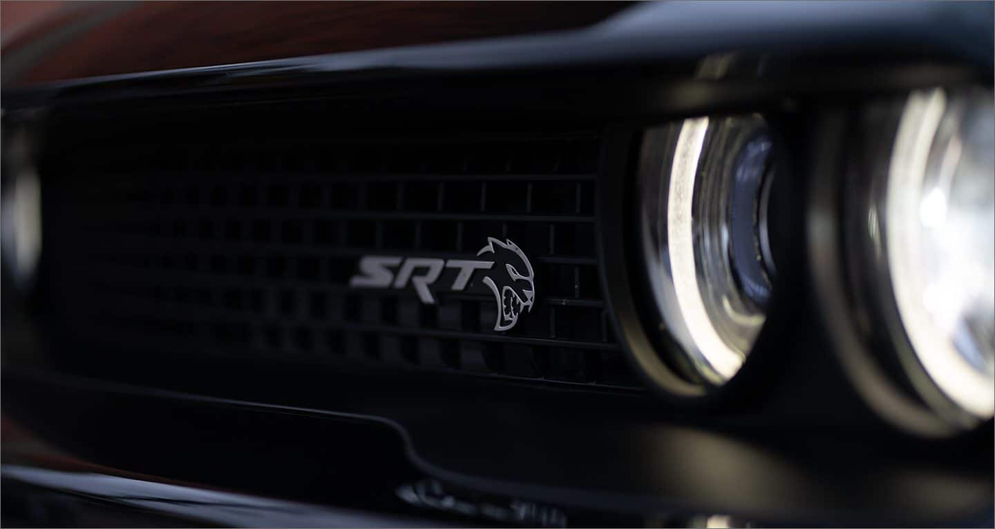 Display A close-up of the SRT Hellcat grille badge on the 2023 Dodge Challenger SRT Hellcat.