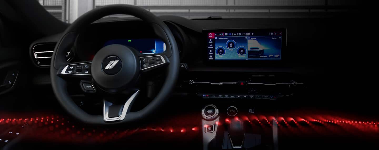 The steering wheel and Uconnect touchscreen in the 2023 Dodge Hornet.