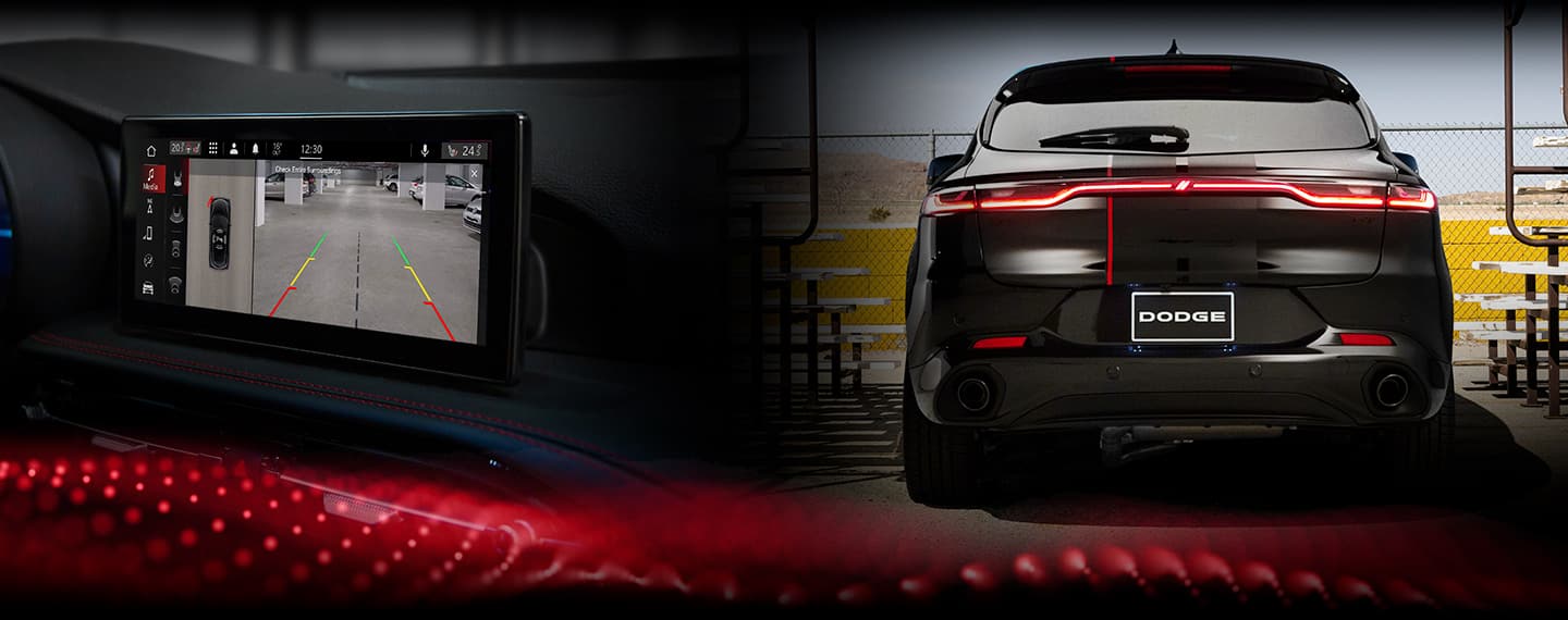 The rear of the 2023 Dodge Hornet with its taillamps on.