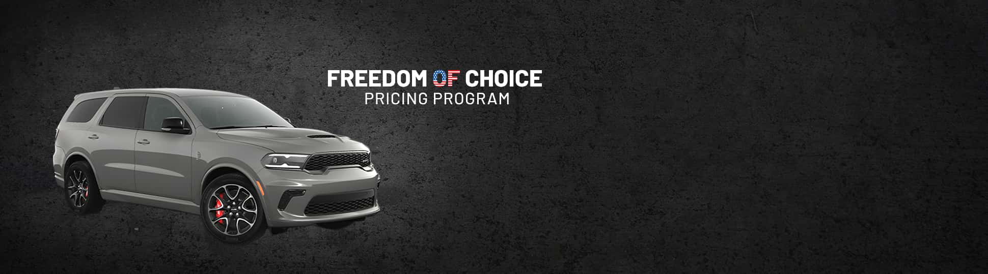 A passenger-side front angle of a gray 2024 Dodge Durango SRT Hellcat. Freedom of Choice Sales Event.