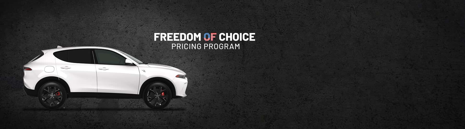 A passenger-side profile of a white 2024 Dodge Hornet R/T. Freedom of Choice Sales Event.