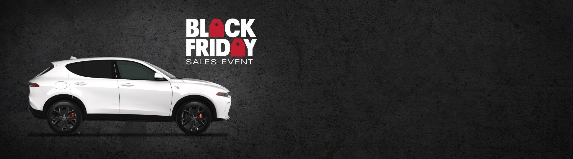 A passenger-side profile of a white 2024 Dodge Hornet R/T. Black Friday Sales Event.