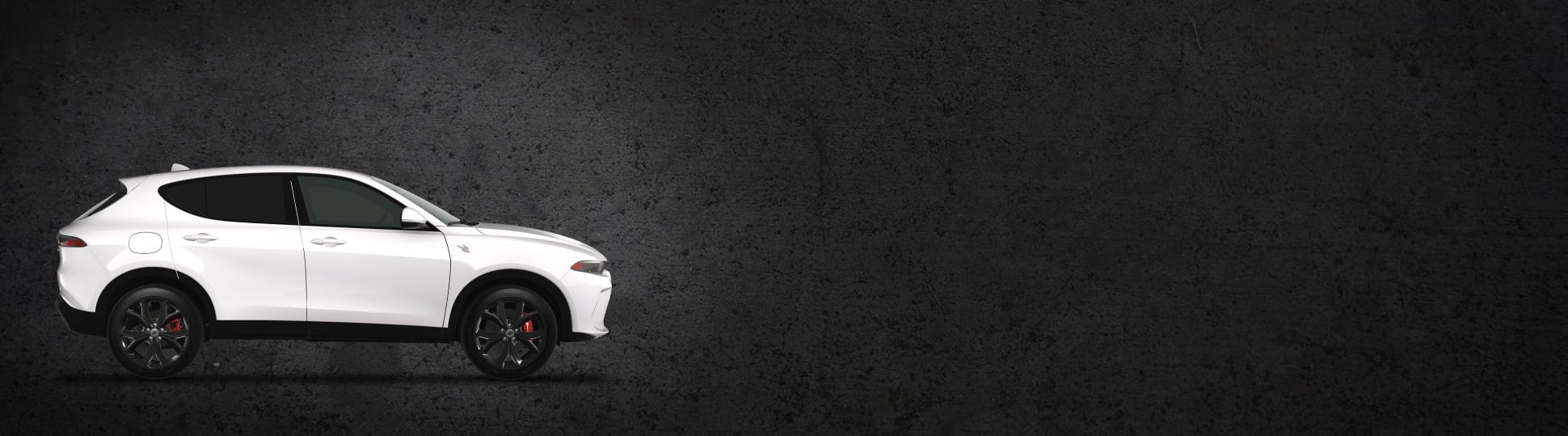 A passenger-side profile of a white 2024 Dodge Hornet R/T. Presidents' Day Sales Event.