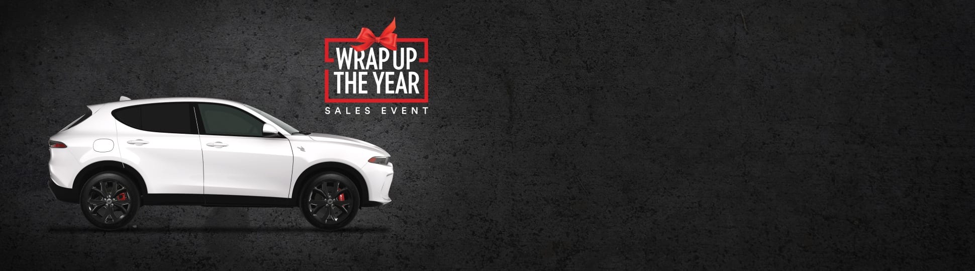 A passenger-side profile of a white 2024 Dodge Hornet R/T. Wrap up the Year Sales Event.
