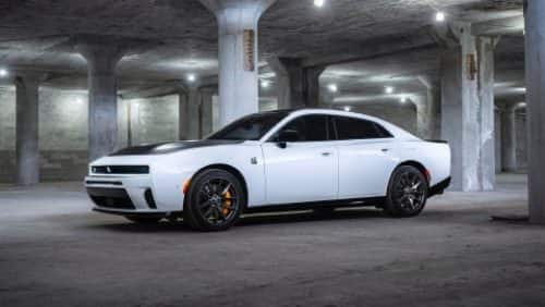 A white 2027 Dodge Charger Daytona Scat Pack with a black hood insert.