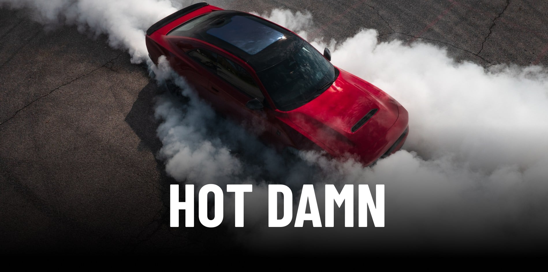 A red 2027 Dodge Charger Scat Pack with glass roof, surrounded by smoke billowing from its tires, shot from overhead. Hot Damn.