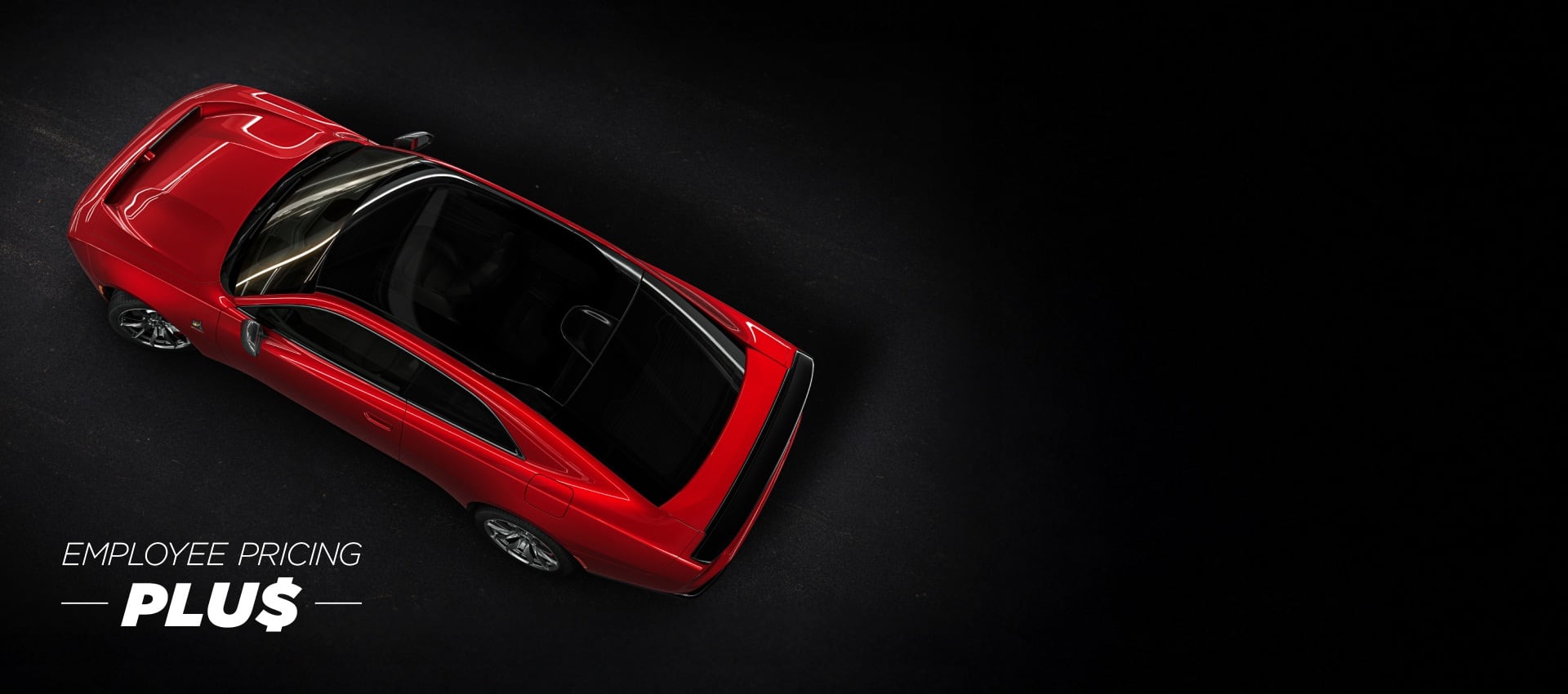 An overhead angle of a red 2024 Dodge Next-Gen Charger Scat Pack highlighting its panoramic glass sunroof. Employee Pricing Plus Sales Event.