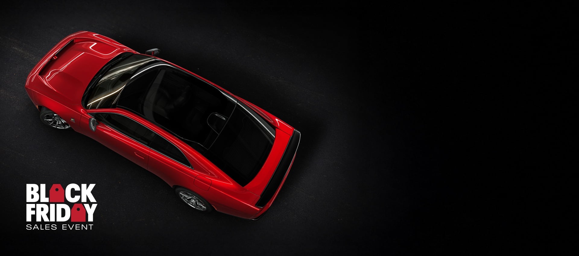 An overhead angle of a red 2024 Dodge Next-Gen Charger Scat Pack highlighting its panoramic glass sunroof. Black Friday Sales Event.