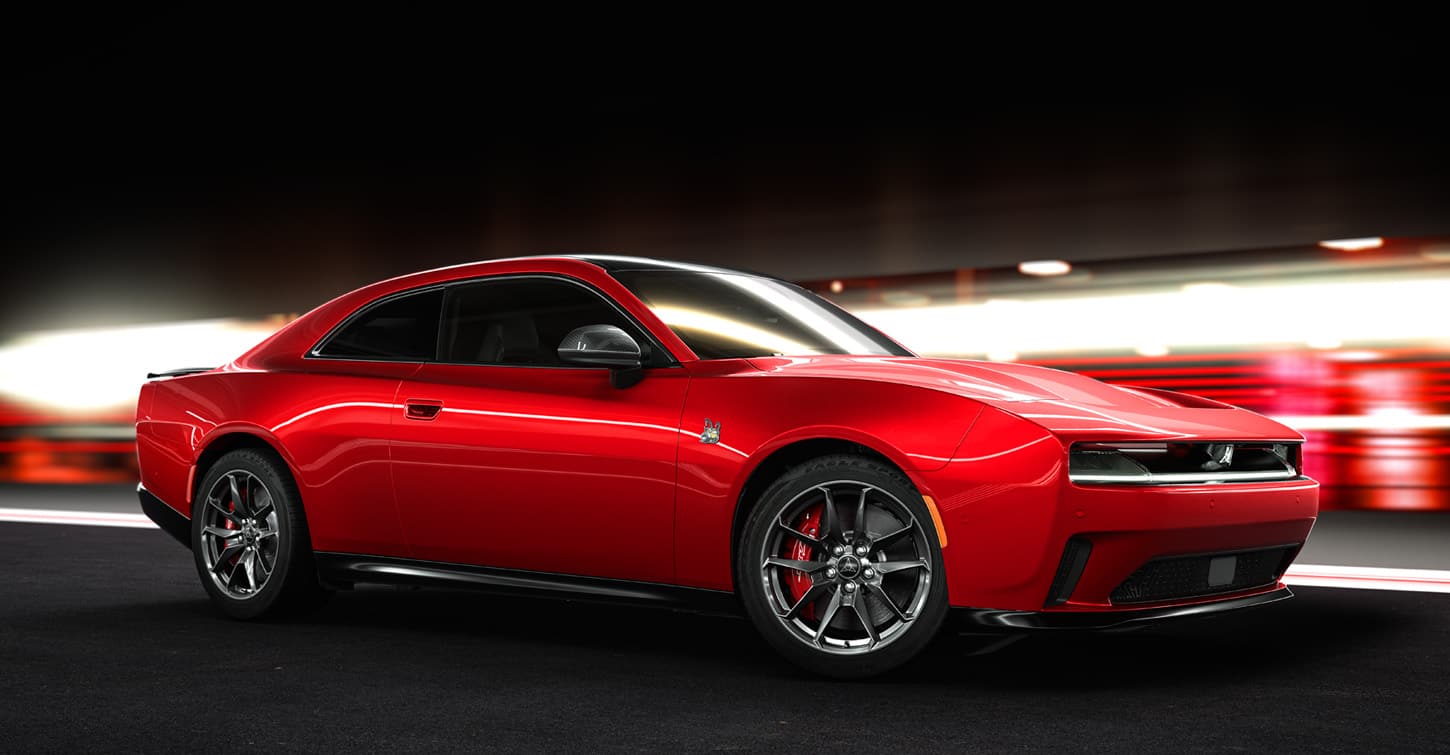 A passenger-side profile of a red 2024 Dodge Charger Daytona Scat Pack BEV two-door.