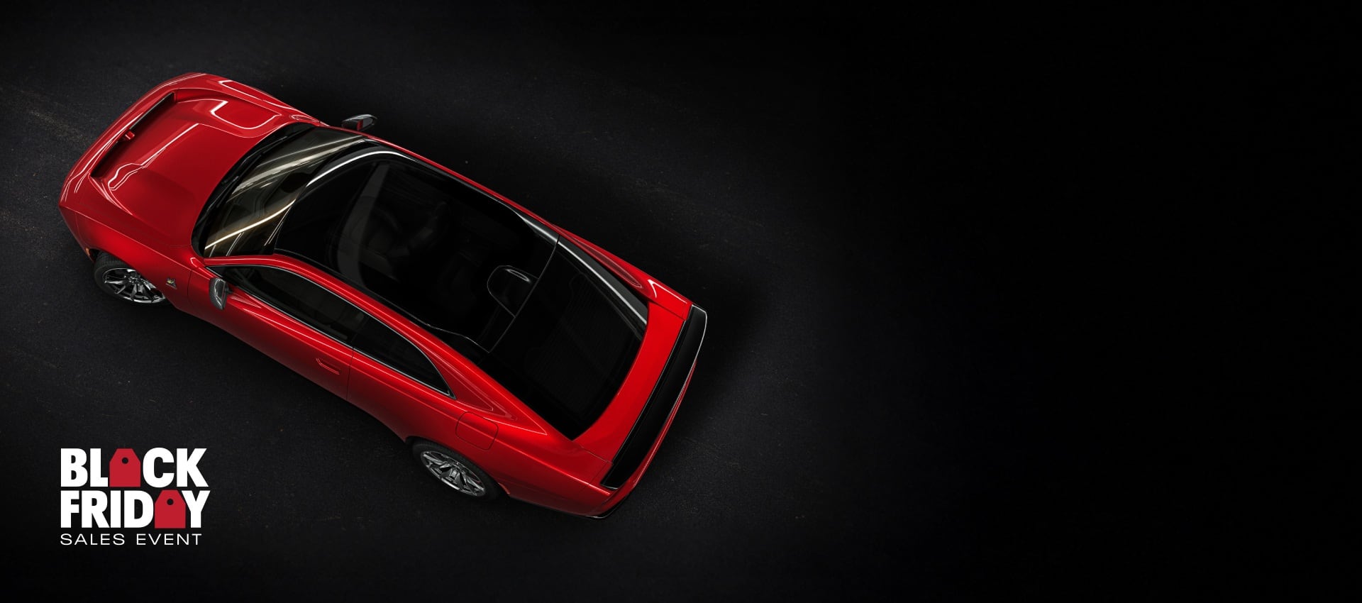 An overhead angle of a red 2024 Dodge Next-Gen Charger Scat Pack highlighting its panoramic glass sunroof. Black Friday Sales Event.