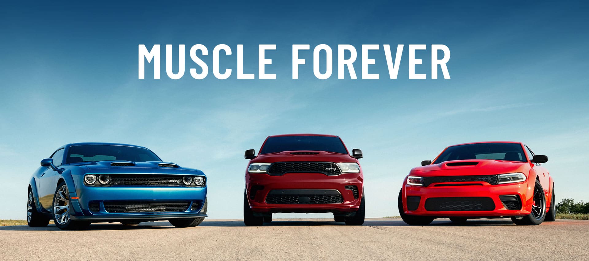 2024 dark red Doge Durango, orange Charger scat pack, and blue Challenger SRT