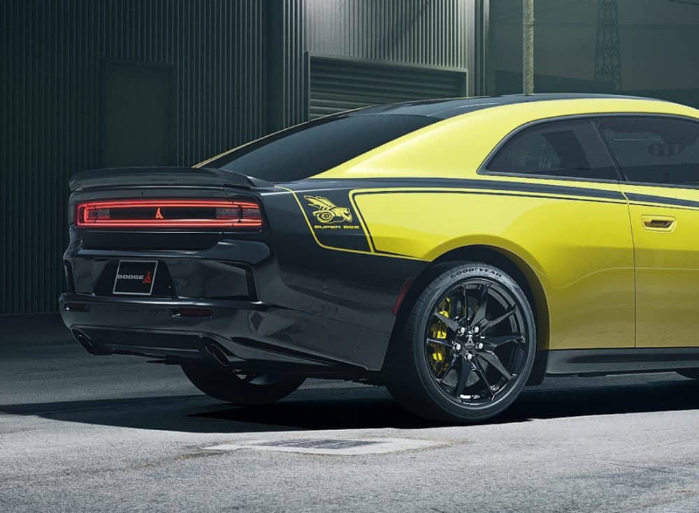 Super Bee graphic, rear spoiler and gloss black wheel on a yellow 2027 Charger