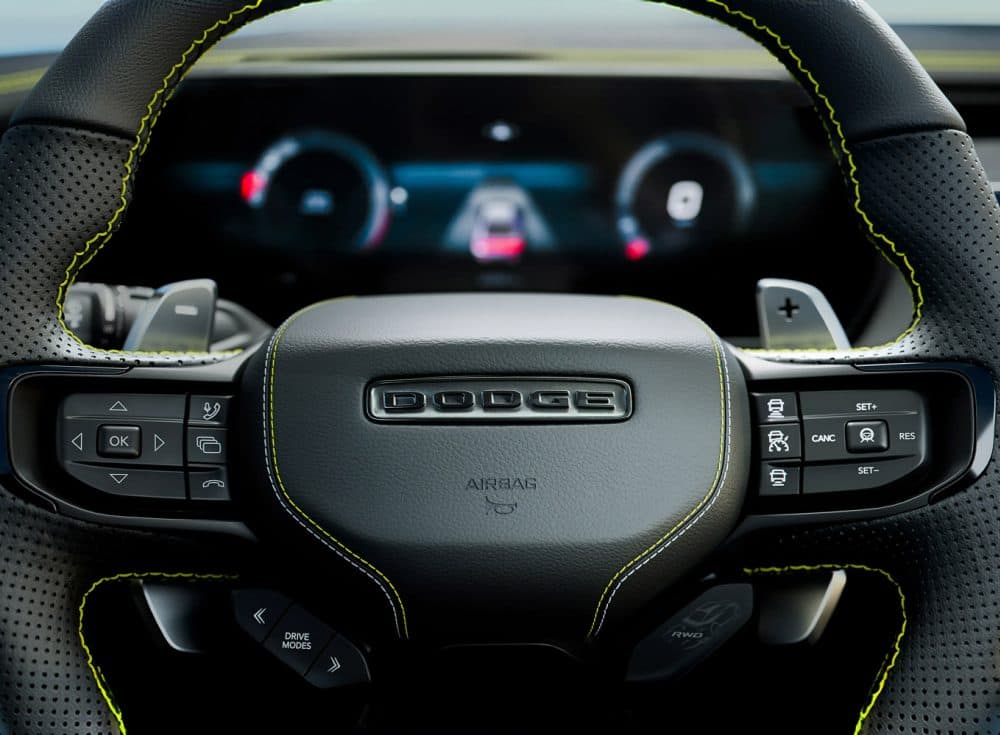 Charger Super Bee performance steering wheel with yellow stitching and paddle shifters