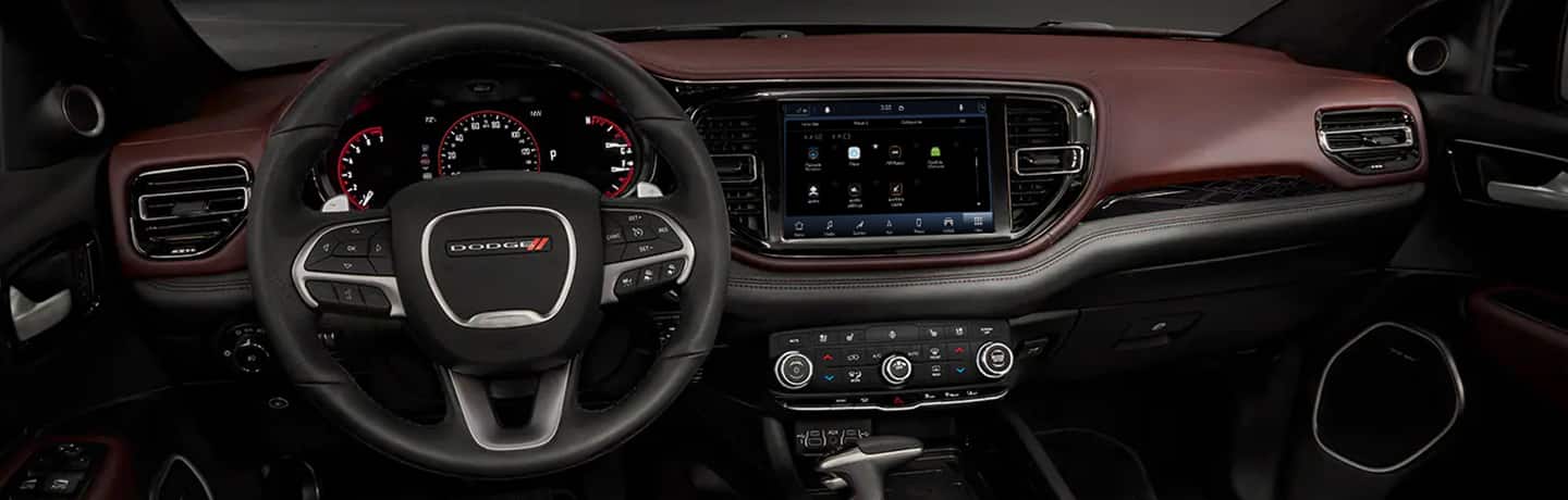  The steering wheel, Uconnect 5 NAV with 10.1-inch touchscreen and dash in the 2022 Dodge Citadel.