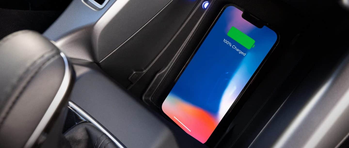 A smartphone on the wireless charging pad in the 2024 Dodge Hornet.